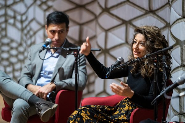 Ramtin Arablouei (left) and Rund Abdelfatah, co-hosts and co-producers of NPR’s podcast “Throughline” and UW–Madison’s fall Journalists in Residence engage in a public panel discussion during a Diversity Forum event held at the Chazen Museum of Art at the University of Wisconsin–Madison on Nov. 14, 2022. Not pictured is panelist Kacie Lucchini Butcher and moderator Christy Clark-Pujara. The museum is currently hosting the the public exhibit: Sifting & Reckoning: UW–Madison’s History of Exclusion and Resistance. (Photo by Jeff Miller / UW-Madison)